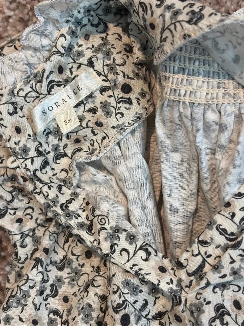 Noralee Smocked Floral Bubble Romper in Cream and Black